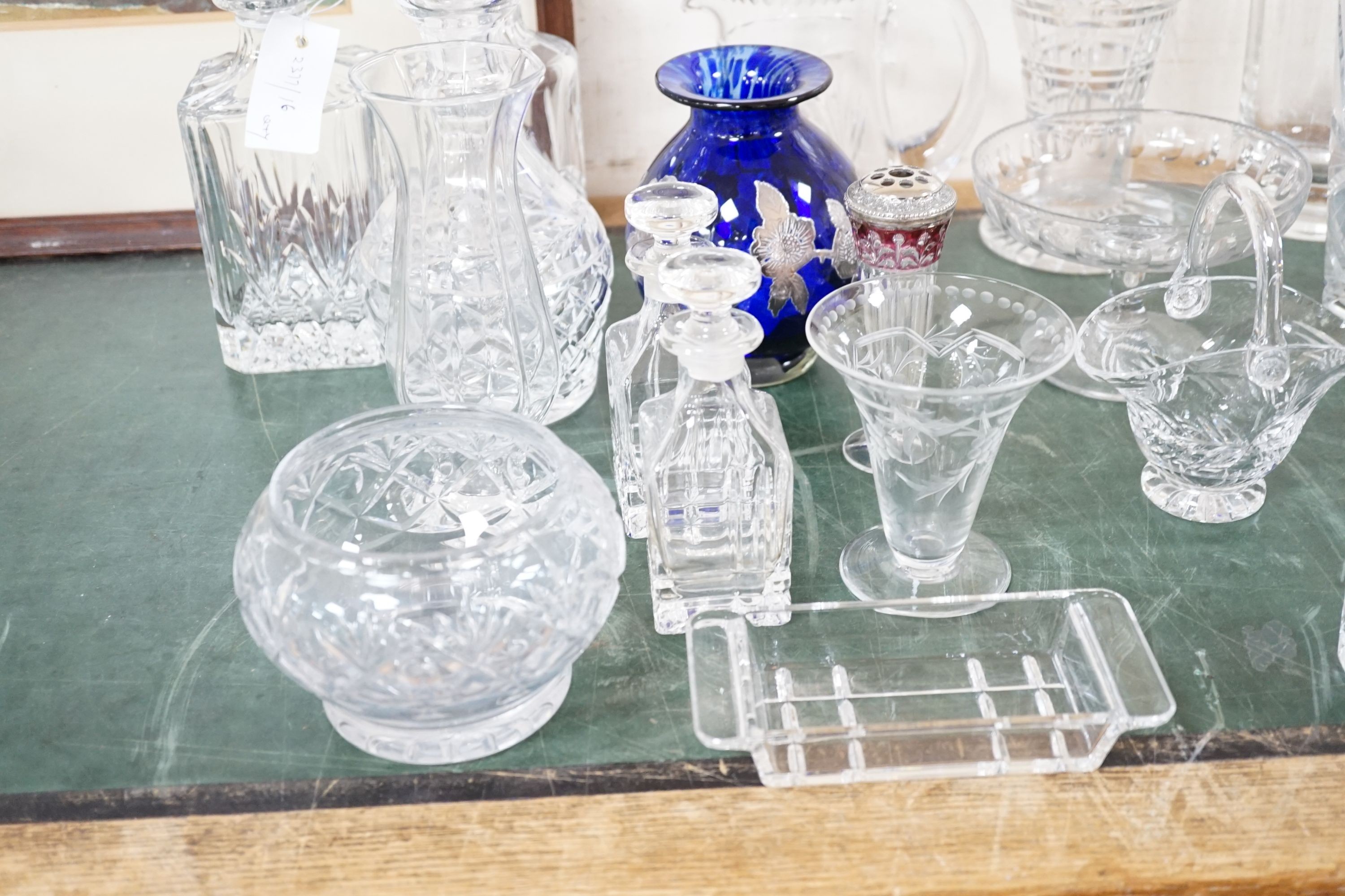 A quantity of cut crystal and other glassware to include decanters, vases, bowls etc